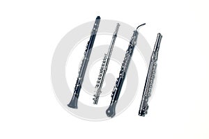 Side-blown flute, clarionet, corno Inglese and piccolo flute isolated on white background