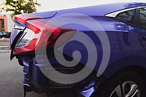 Side of a blue modern car after a crash accident.