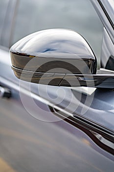 Side car mirror close-up. Details of business car