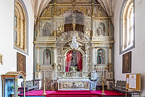 side chapel with the figure of jesus christ holding the cross inside the main church in the alentejo locality of Estremoz