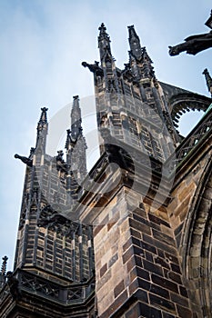Side column of the gothic Vysehrad cathedral in Prague featuring beautiful windows and stone wall and pillars