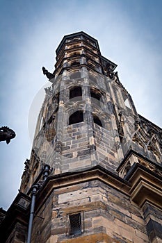 Side column of the gothic Vysehrad cathedral in Prague featuring beautiful windows and stone wall and pillars