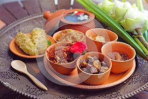 Side dish of Kao Chae set in pottery, Thai traditional food