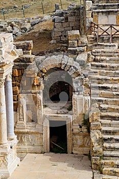 Side entrance to the stage of the amphitheater. Ancient antique amphitheater in city of Hierapolis in Turkey