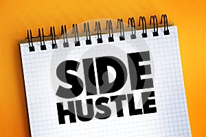 Side Hustle - additional job that a person takes in addition to their primary job, text on notepad