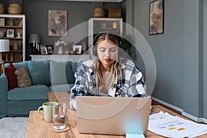 Side hustle money, second job concept. Young university student woman working freelance internet online job to pay student loan,