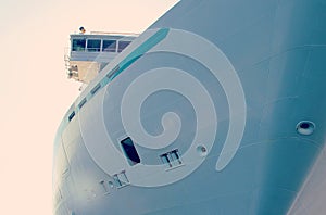 Side of a large passenger ship, windows in the side of the ship, the ship`s captain`s bridge