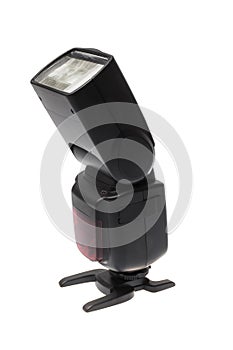 Side look of a DSLR camera speedlite flash on its stand, isolated on white background