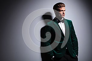 Side of a man in green velvet elegant suit