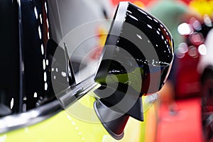 Side mirror of a modern car bokeh light background