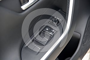 Side mirror switch control and window button