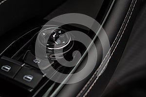 Side mirrors control panel on side door.