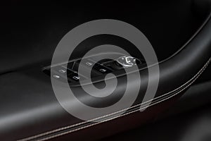 Side mirrors control panel on side door.