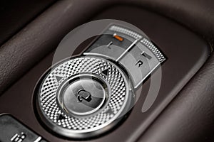 Side mirrors control panel on side door.