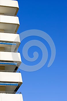 Side of modern, sunny apartment block in Spain