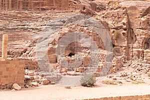 The side part of the well preserved amphitheater carved by Nabatean craftsmen into rock in the Nabatean Kingdom of Petra in the