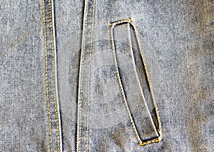 Side pocket of denim jacket close-up, clothes, jean, buttonhole, fabric texture