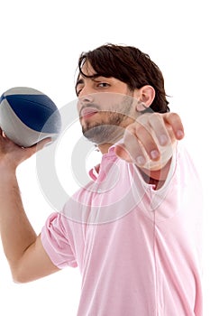 Side pose of man with rugby ball