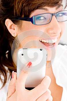 Side pose of smiling female holding ipod