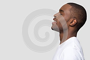 Side profile african man face closed eyes enjoy fresh air