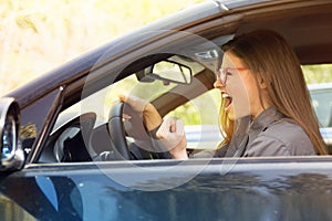 Side profile of an angry driver.