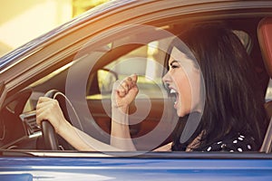 Side profile of an angry young driver