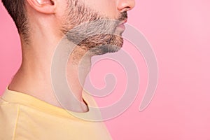 Side profile cropped photo of serious positive man stylish haircut yellow t-shirt look empty space isolated on pink