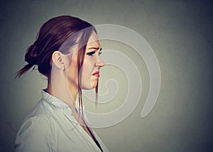 Side profile disgusted annoyed young woman