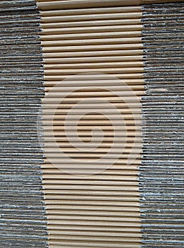 Side profile of flattened brown cardboard boxes, for texture or background