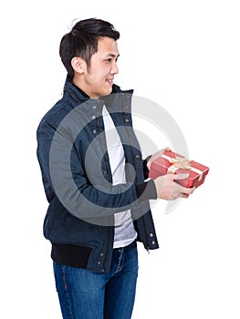 Side profile of man give gift box to other