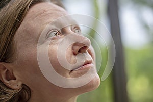 Side profile of a mature woman thinking