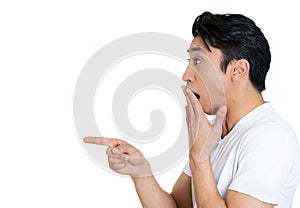 Side profile of a shocked man pointing finger at someone