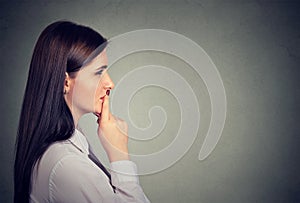 Side profile of a thoughtful young woman