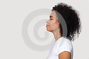 Side profile view african woman closed eyes dreaming