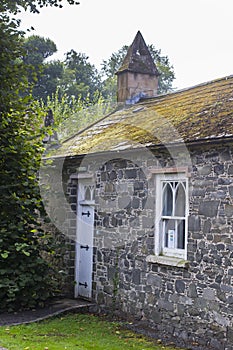 The side of the Sexton`s building at the gateway to grounds of St Malachy`s Parish Church in Hillsborough photo