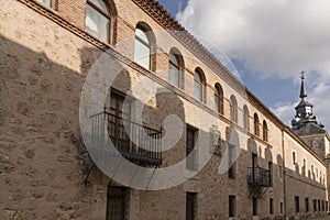 Side shot of a building with arch-shaped windows and balconiesurope