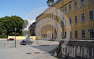 Side square north of the Mafra Palace, dark blue Jaguar Mark IX in the foreground, Portugal