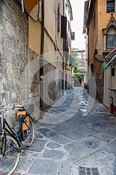 Side street of Pisa, paddle parked