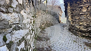 Side streets with historical stone buildings and sidewalks