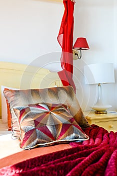 Side table with white lamp in the bedroom