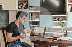 Side of thoughtful man holding cup