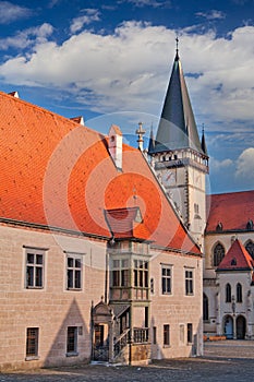 The side of Town Hall and the tower of Church of St. Egidius  on Town hall square in Bardejov town during summer evening