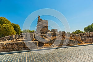 SIDE, TURKEY: Ancient ruins and a road in the city of Side on a sunny summer day.