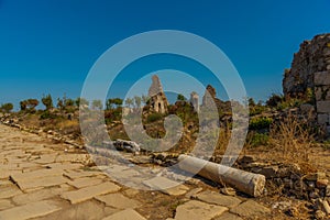 SIDE, TURKEY: Ancient ruins and a road in the city of Side on a sunny summer day.