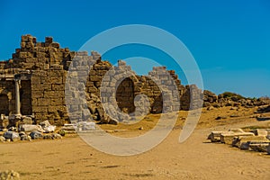 SIDE, TURKEY: Ancient ruins and a road in the city of Side on a sunny summer day.