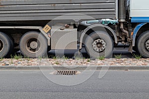 Side view of a 4 axle truck. Transportation of heavy bulk cargo