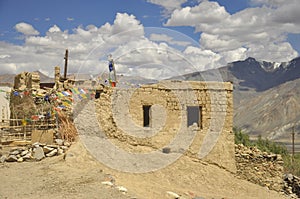 Side view of a abandoned ladakhi house with tibetan prayer flags in Padum, Zanskar Valley, Ladakh, INDIA