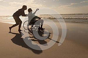 Senior couple taking selfie with mobile phone on the beach