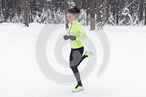 Side view of active sporty young running woman