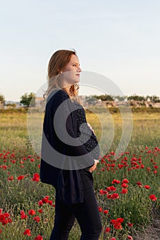 Side view of Adorable pregnant Woman Touching Her Belly